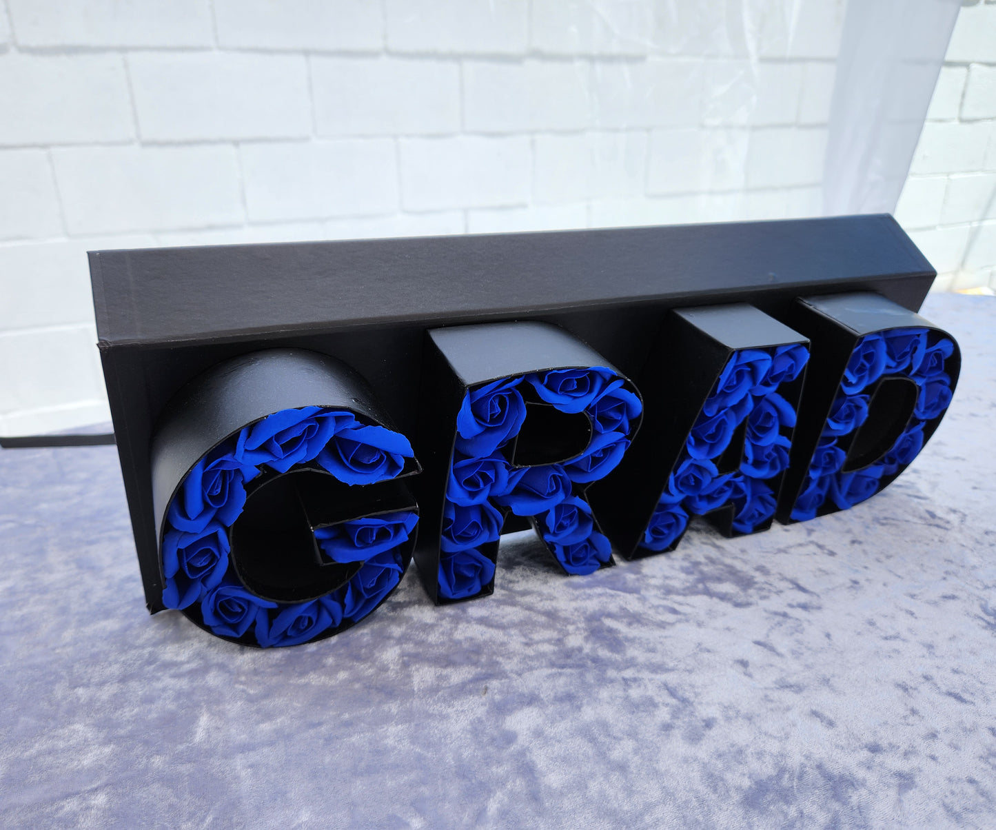 Black "GRAD" box with 36 Blue Rose Soaps
